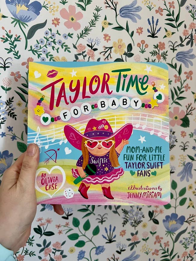 Person holding a children's book titled 