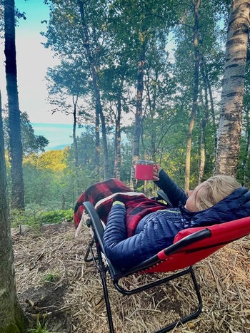 Reviewer enjoys the lounge chair outside