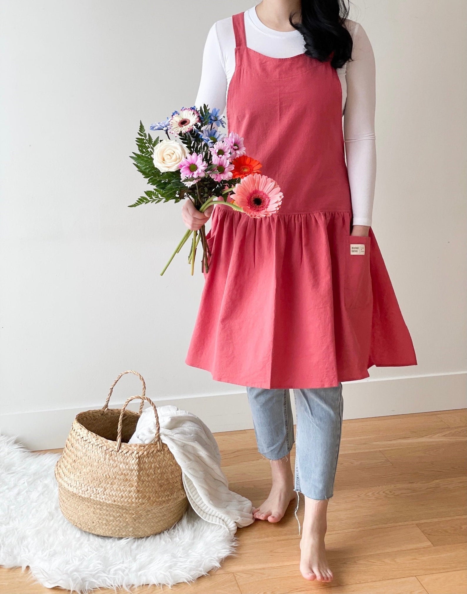 person wearing loose dress with leggings and a turtleneck underneath