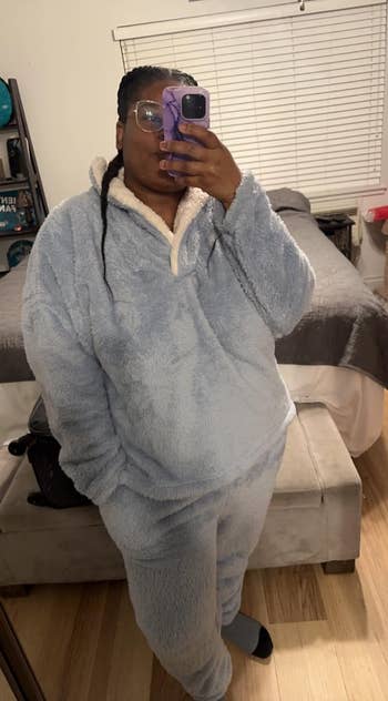 a reviewer wearing the hoodie and pants successful airy grey