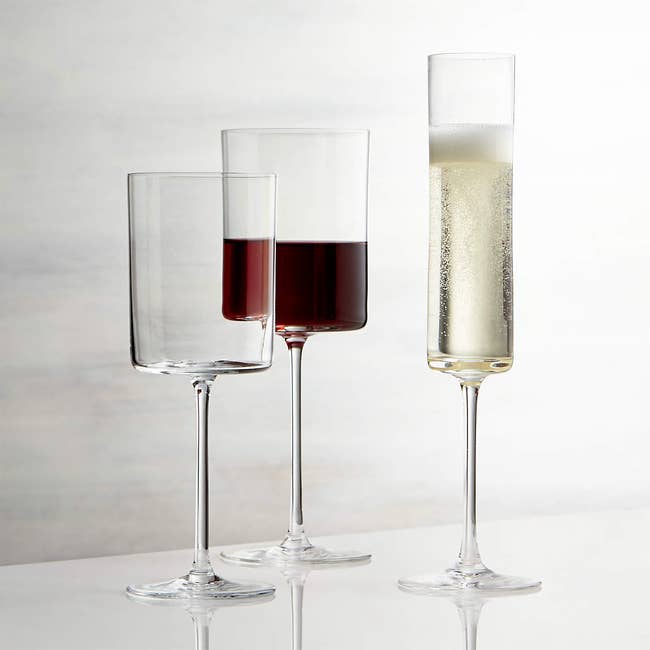 A trio of wine glasses in the same style in different sizes for red, white, and champagne wine 