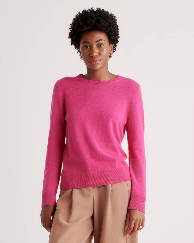 model wearing the crewneck sweater in pink