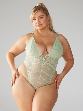 model wearing mint green lace teddy