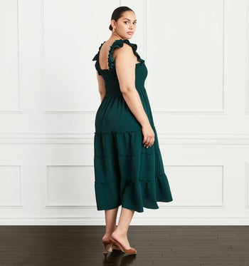 a model in a crepe green nap dress
