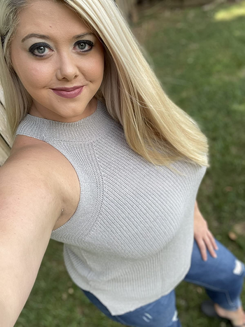 reviewer selfie wearing gray knit halter top