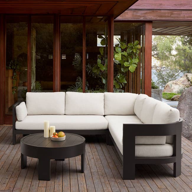 Outdoor furniture set with a sectional sofa and table on a patio