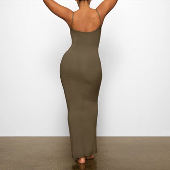 model showing the back view of the olive dress