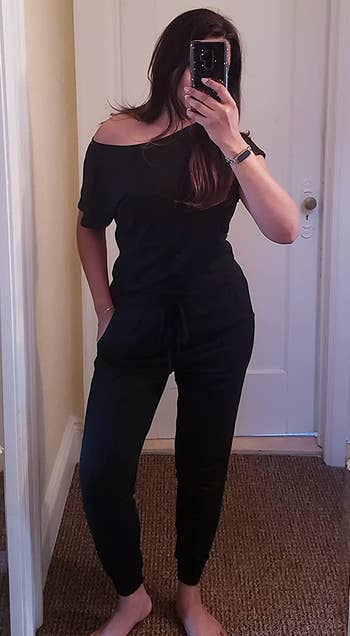Image of reviewer wearing black jumpsuit