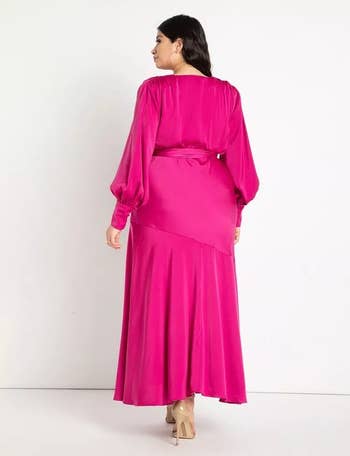 model shown from the back wearing the hot pink satin maxi dress
