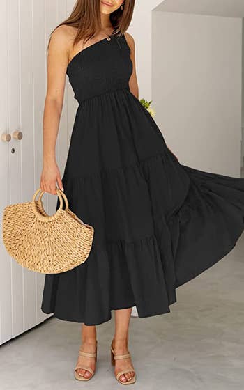 model in black one-shoulder midi dress