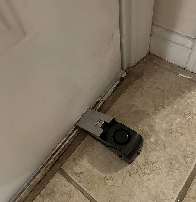 Reviewer photo of the door stopper put up against a front door