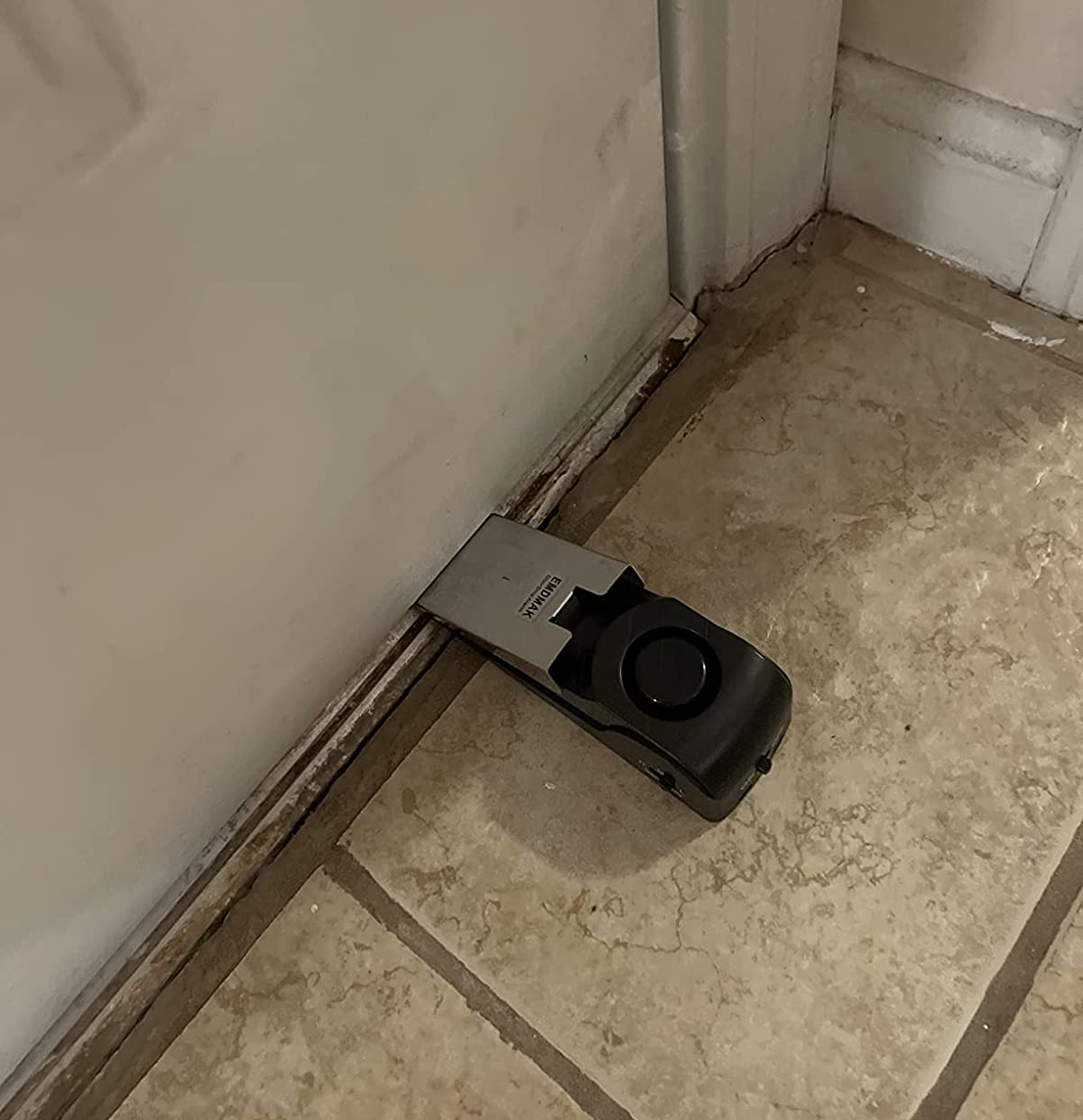 Reviewer photo of the door stopper put up against a front door