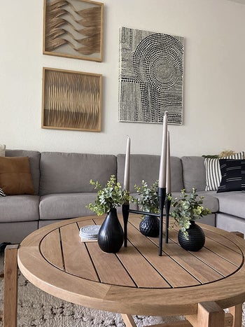 reviewer image showing wall art that was easy to hang with this tool