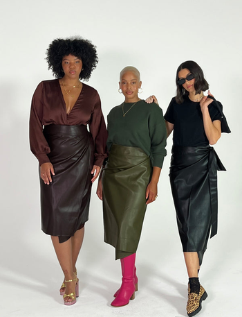 three models wearing the different colors of skirt