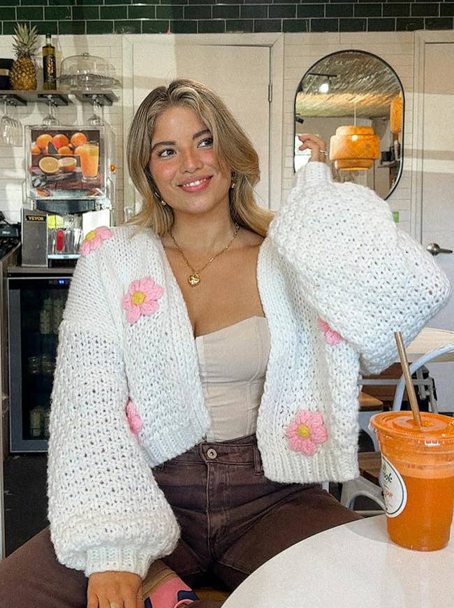 model in white flower knit cardigan