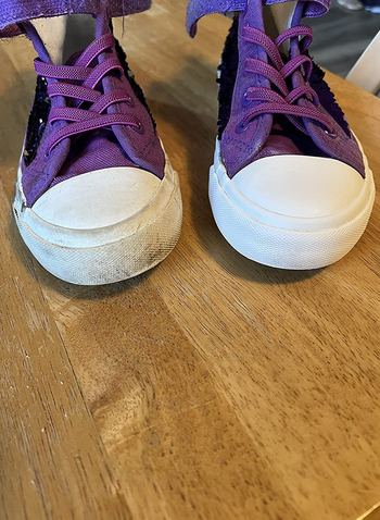 reviewer shows before and after of dirty shoes now clean