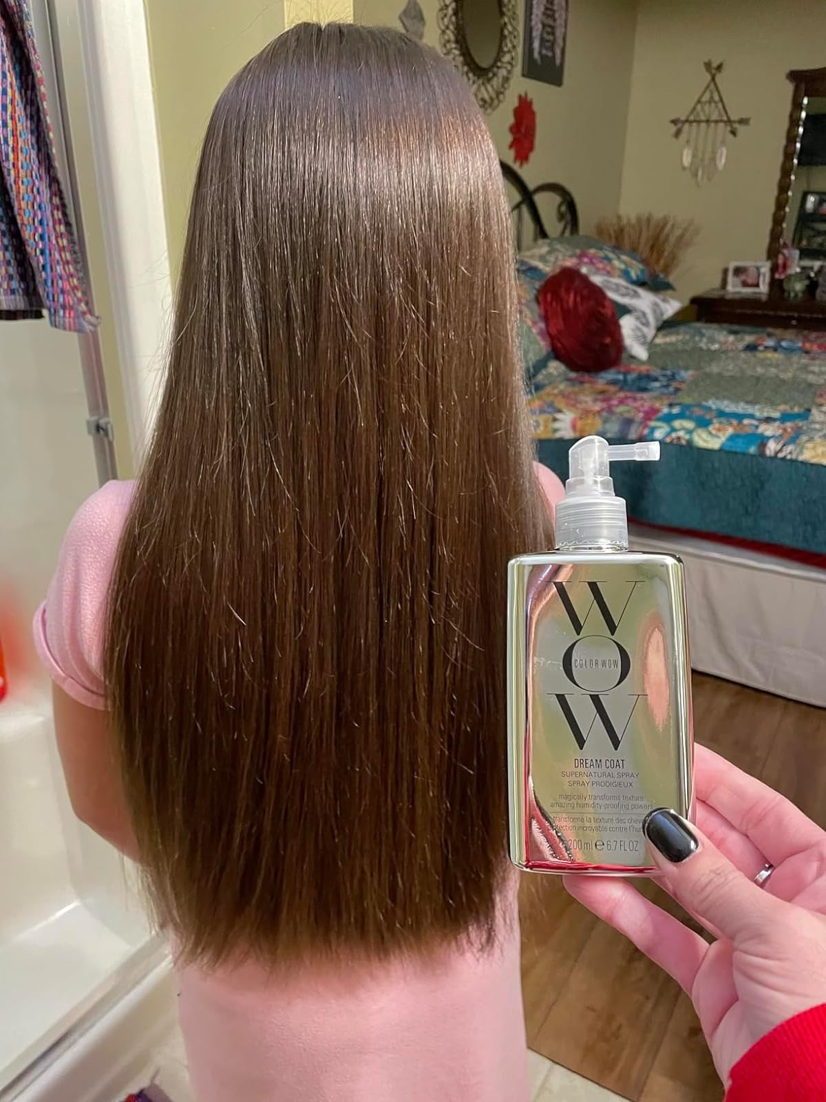 Person holding a hairsbreadth  attraction   merchandise  beside long, consecutive  hair, apt  endorsing its use
