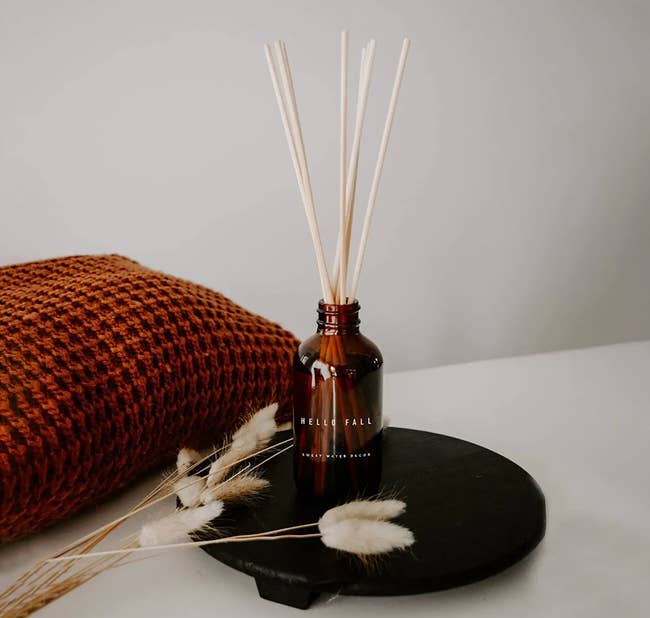 the reed diffuser on a decorative tray