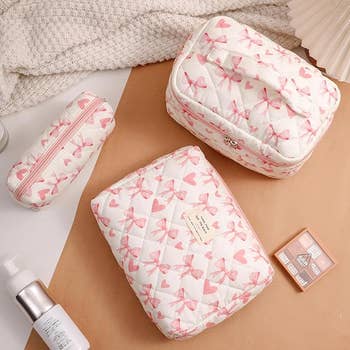 Cosmetic bags with pinkish bow patterns