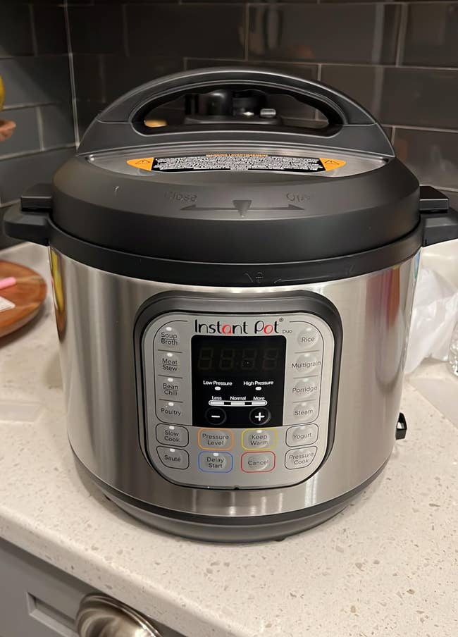 Instant Pot unit cooker connected a room antagonistic with power sheet showing settings