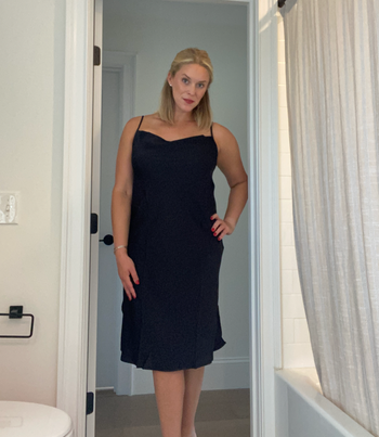 another reviewer wearing the dress in black