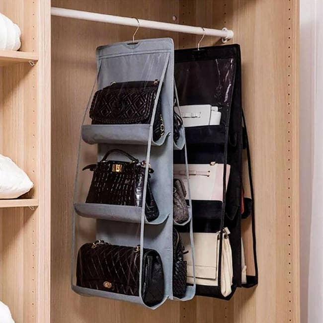 the hanging organizers in gray and black, each with three slots on the front and three on the back, hanging on a closet rod