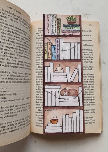 the bookmark with some of the spines filled in with colors and titles