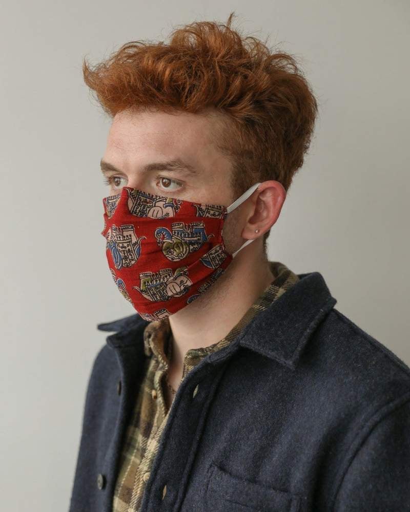 model wearing the red face mask