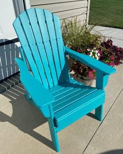 another reviewer's teal Adirondack chair outside