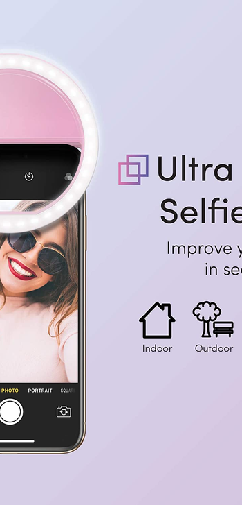 the pink ring light clipped to the top of a phone