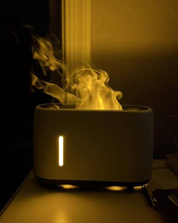 the white flaming humidifier in a dark room
