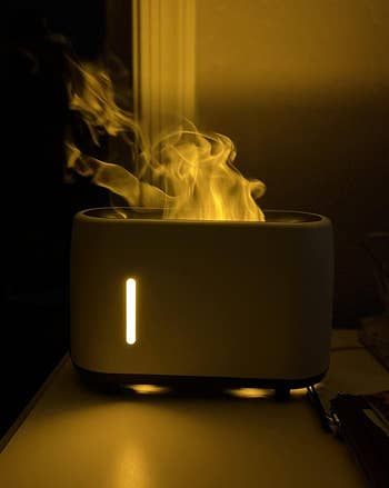 the white flaming humidifier in a dark room