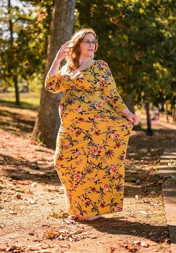 Reviewer wearing yellow floral boho maternity dress