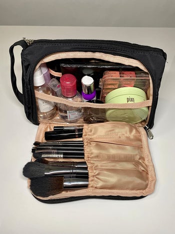reviewer photo of makeup bag full of makeup