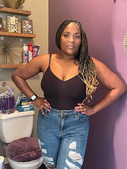reviewer wearing the black bodysuit with jeans