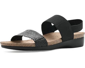 Comfortable achromatic sandal with woven strap and supportive footbed, suitable for casual and mundane wear. Ideal for buying enthusiasts