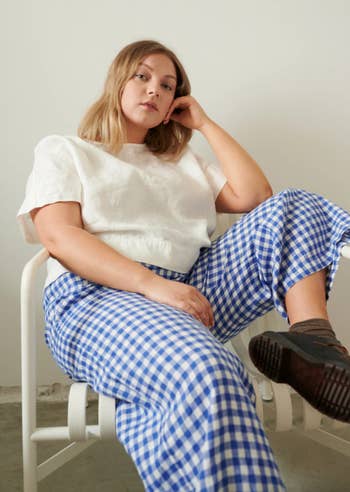 a close up of the blue and white gingham pants