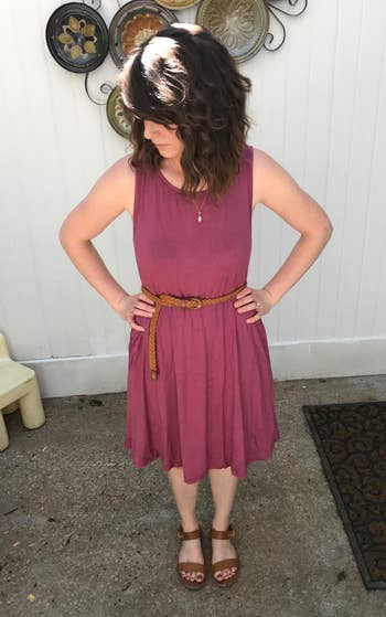 reviewer in the red t shirt dress with a brown belt