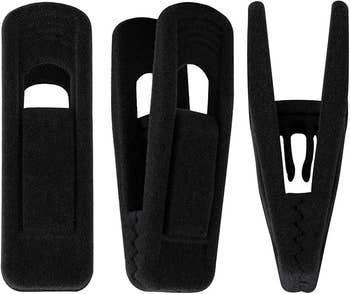 Three velvet hanger clips connected  a achromatic  background
