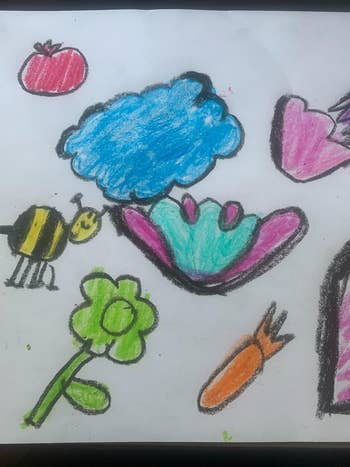 Child's drawing of various objects, including a flower, bee, and hearts, in a simple, playful style