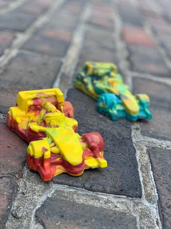 two cars made of crayons