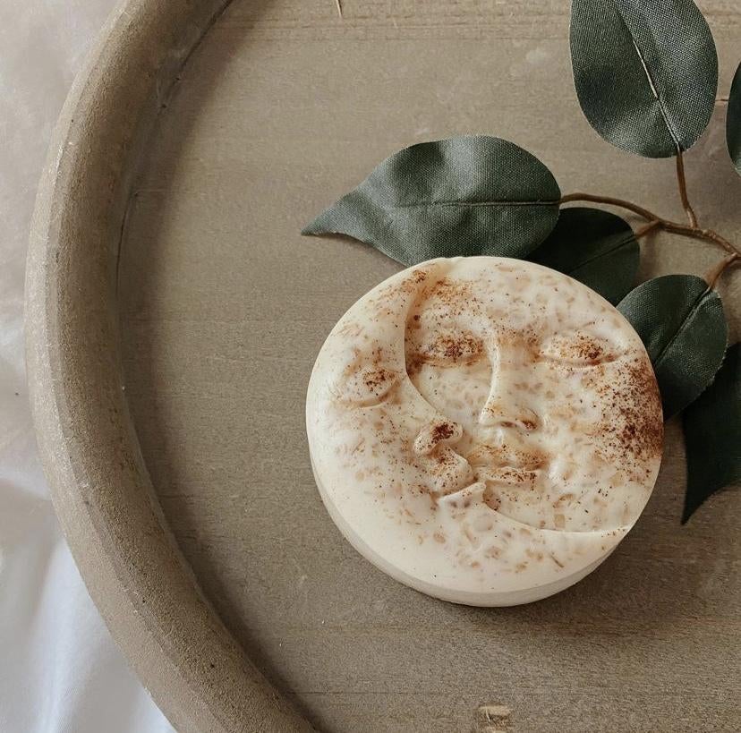 a bar of soap with two moons carved into it