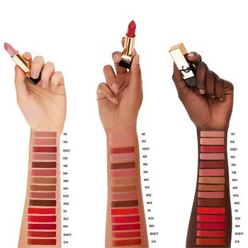 three different arms with various shades of lipstick on it