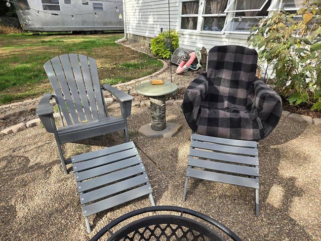 Two outdoor chairs with a checkered broad and matching footrests are acceptable by a tiki-themed array connected a patio, adjacent to a location and garden