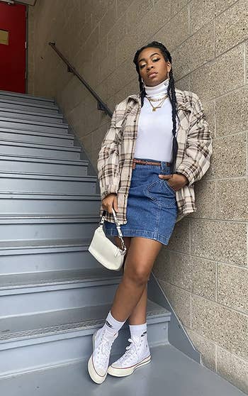 reviewer wearing the shacket in white and brown plaid