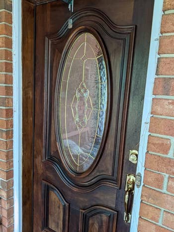 a fully polished front door that looks shiny and new