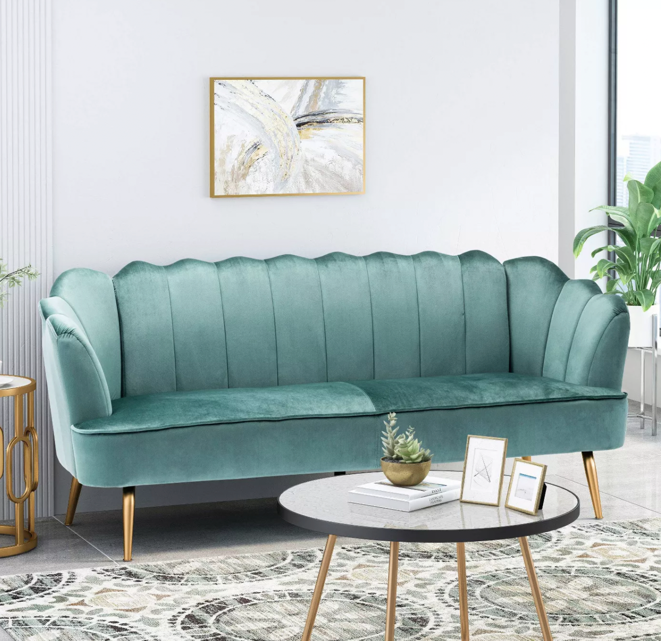 a teal velvet couch in a living room
