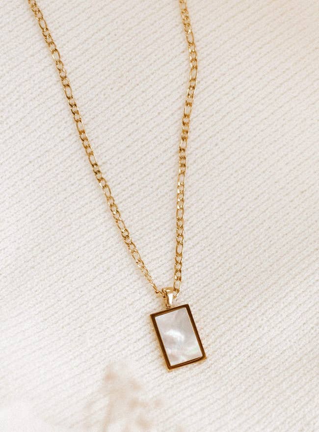 rectangular pendant on gold chain