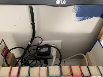 reviewer showing their wires being concealed using the covobox