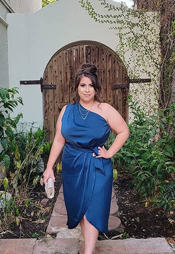 reviewer in the blue satin dress